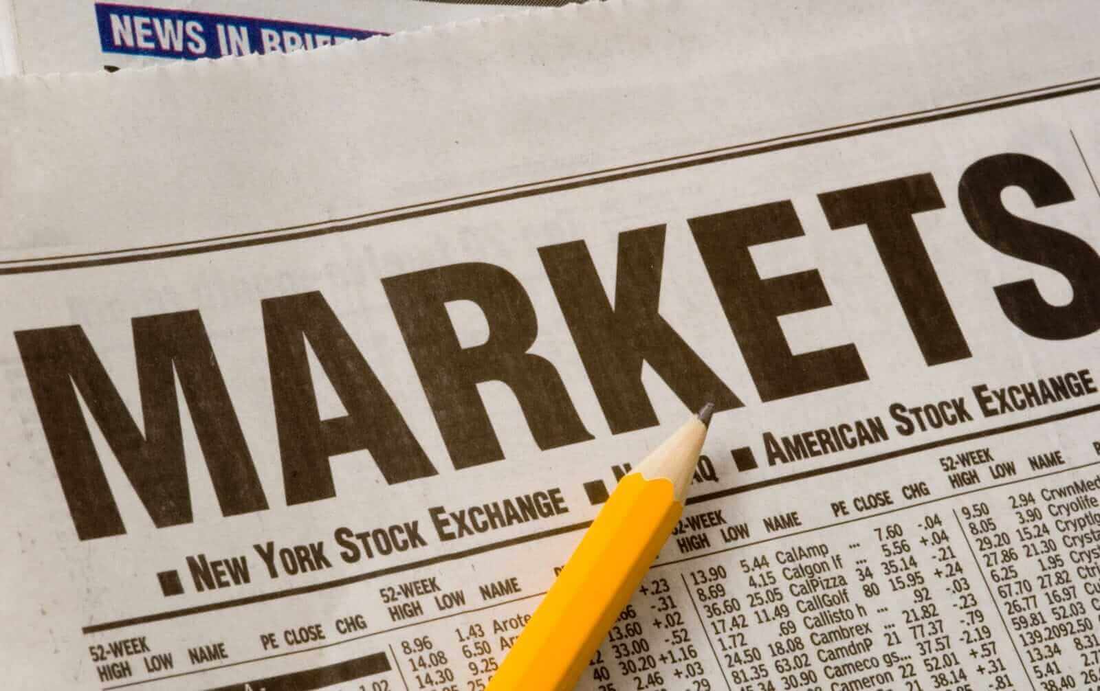 Newspaper open to market pages by Mike Flippo via Shutterstock